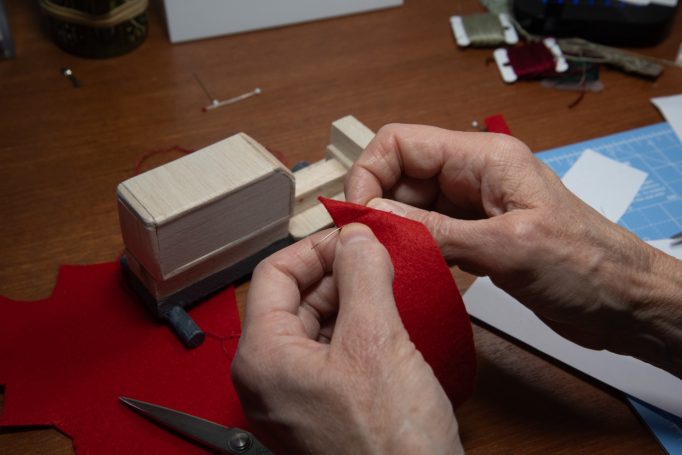 Work starts on covering with red felt