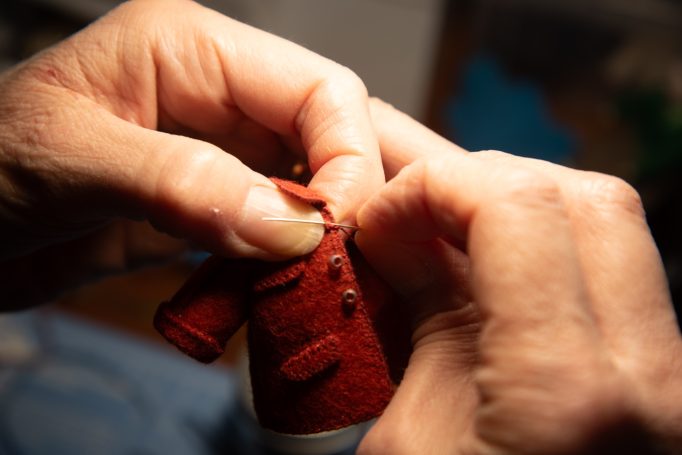 Sewing on the buttons