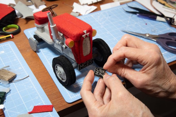 Number plate hand sown